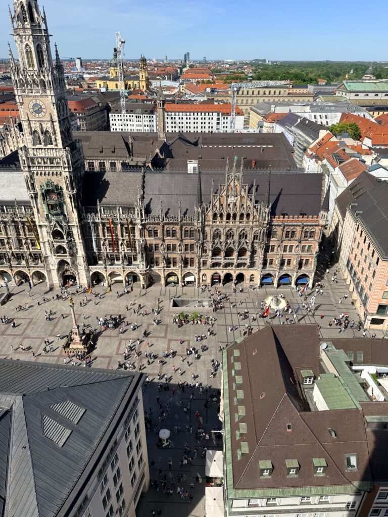 Aerial view of Marienplatz Munich Germany showing the Neo-Gothic New Town Hall and the Glockenspiel tower with the city of Munich Bavaria stretching to the horizon