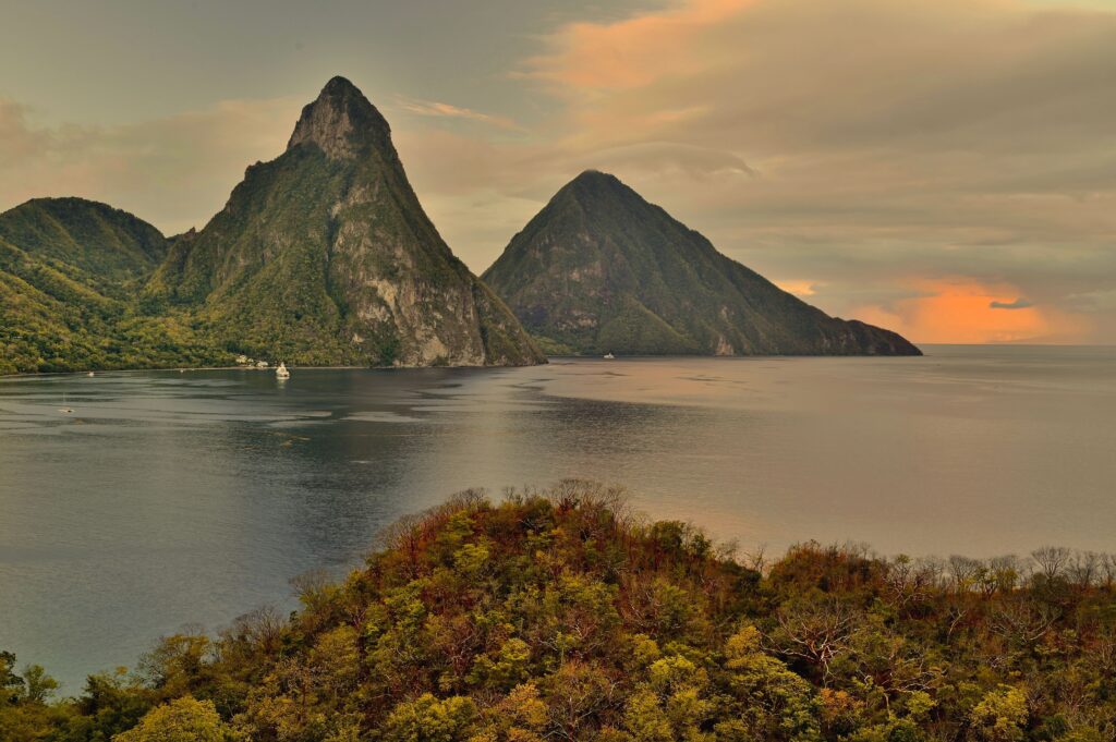 Gros Piton and Petit Piton mountains rising from the sea at sunset near Soufrière, St Lucia